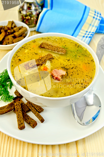 Image of Soup pea with croutons and napkin