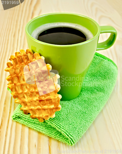 Image of Waffles circle with a green mug on the board