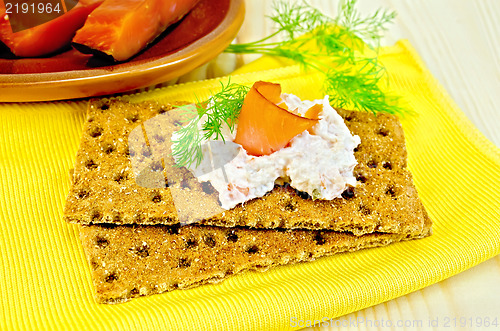 Image of Bread with mayonnaise and salmon on board