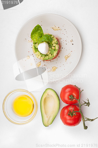 Image of Tomatoes, avocado and olive oil with salad