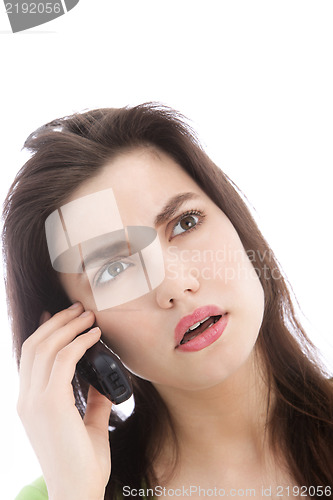 Image of Woman listening to a call on a mobile