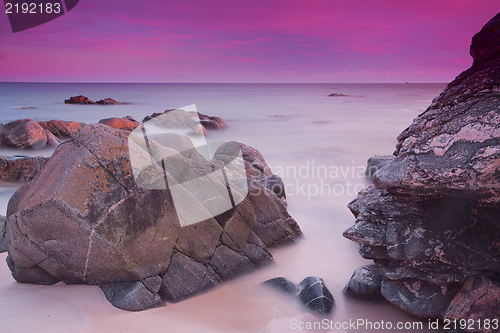 Image of Purple skies over ocean