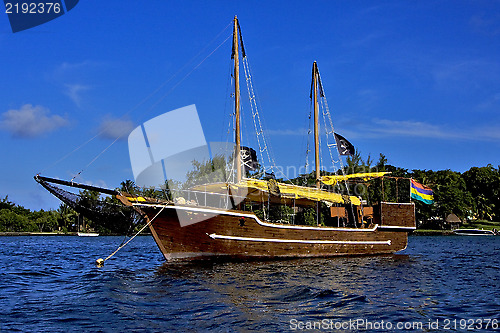 Image of pirate boat  and coastline