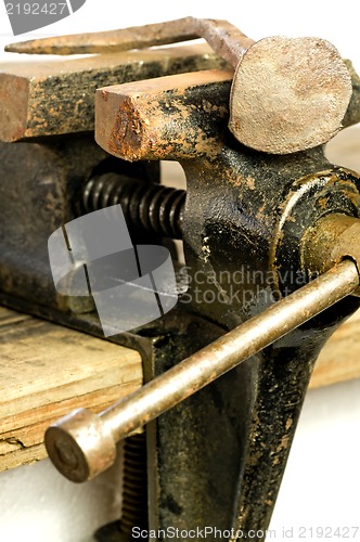 Image of Bench vise with twisted nail