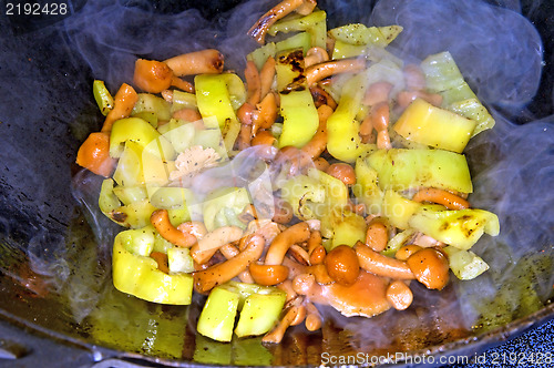 Image of vegetables, tofu and mushroom in a Chinese wok