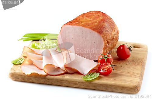 Image of Smoked meat on wooden cutting board