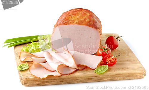 Image of Smoked meat on wooden cutting board