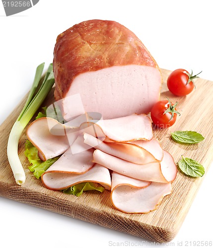Image of Smoked meat on wooden cutting board