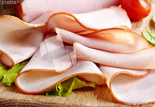 Image of Smoked meat on wooden cutting board