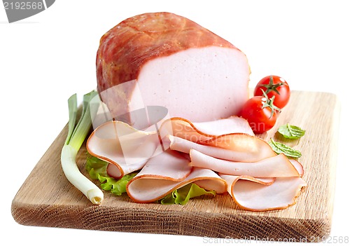 Image of Smoked meat on wooden cutting board