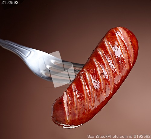 Image of Grilled smoked sausage on a fork