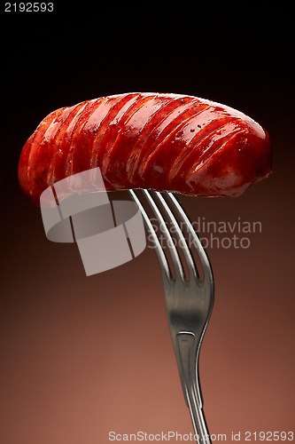 Image of Grilled smoked sausage on a fork