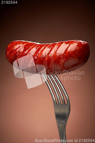 Image of Grilled smoked sausage on a fork