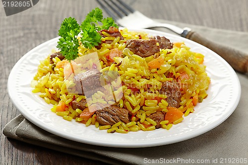 Image of Uzbek national dish plov on plate