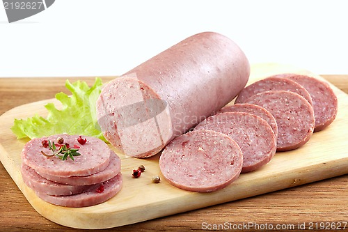 Image of Salami sausage on wooden cutting board