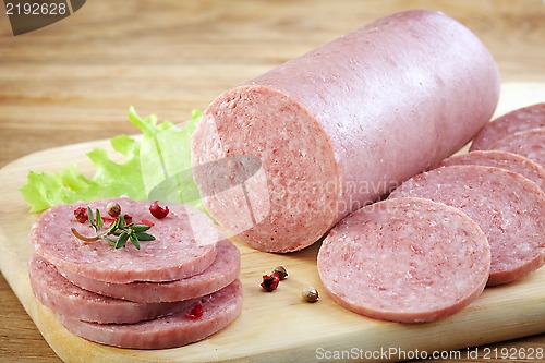 Image of Salami sausage on wooden cutting board