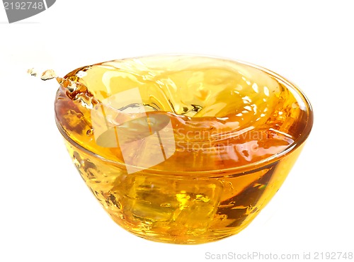 Image of yellow apple juice in a glass bowl