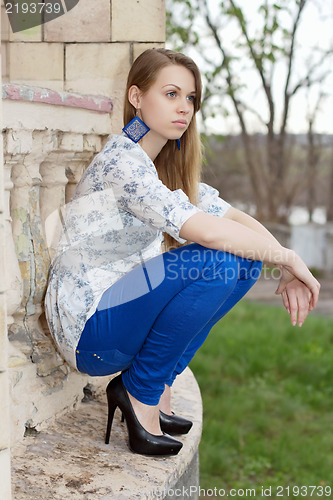 Image of Young thoughtful blond woman