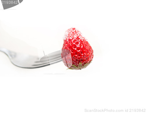 Image of srawberry on a fork isolated