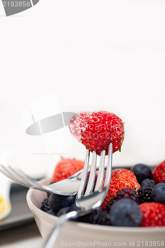 Image of srawberry on a fork isolated