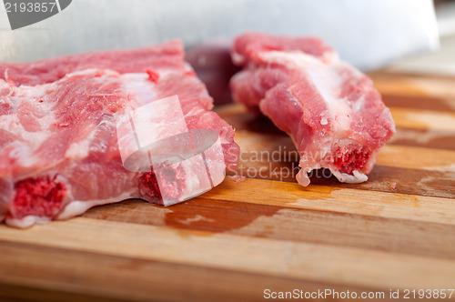 Image of chopping fresh pork ribs 