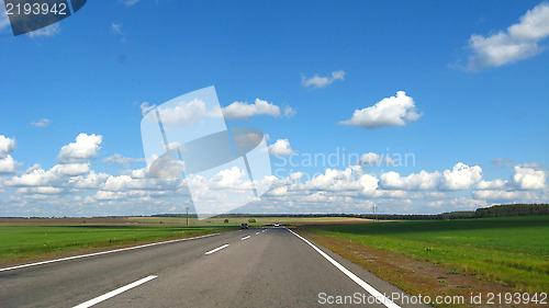 Image of asphalted road and the blue sky