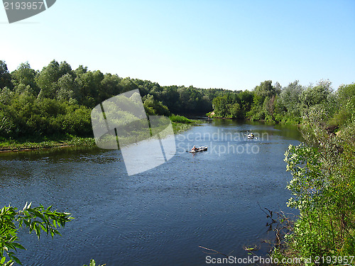 Image of beautiful landscape with river and canoe on it