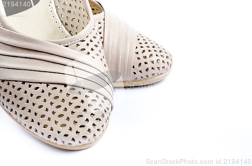 Image of Pair of light-colored shoes isolated on a white background