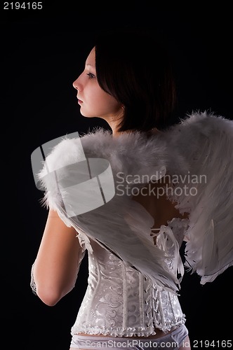 Image of Back view of young woman in angel role