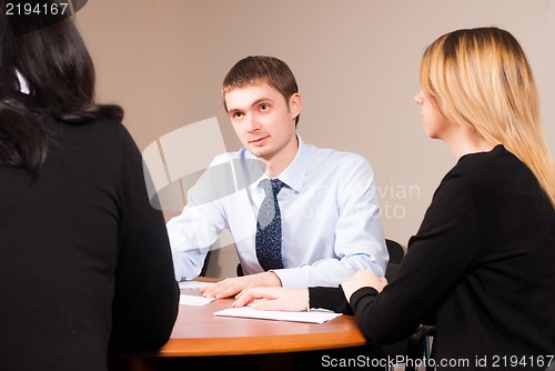 Image of Young and successful businessman in the office