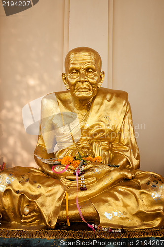 Image of Gold buddhist monk statue