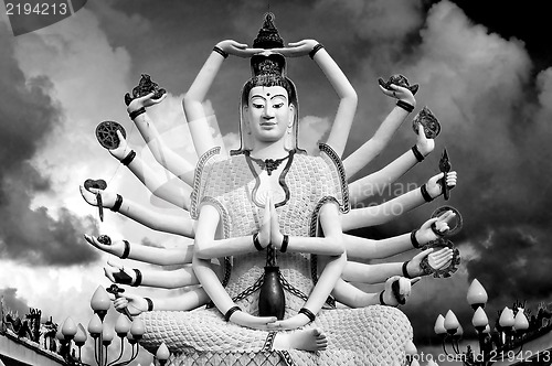 Image of Eighteen arms Buddha over sky