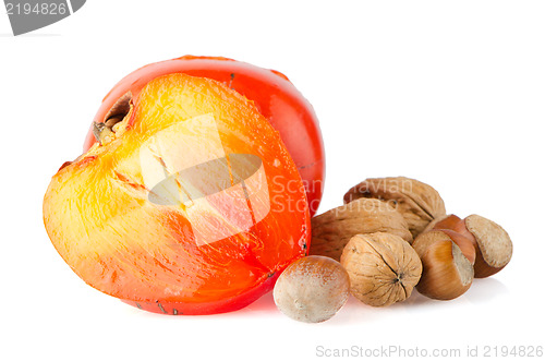 Image of Ripe persimmons and nuts