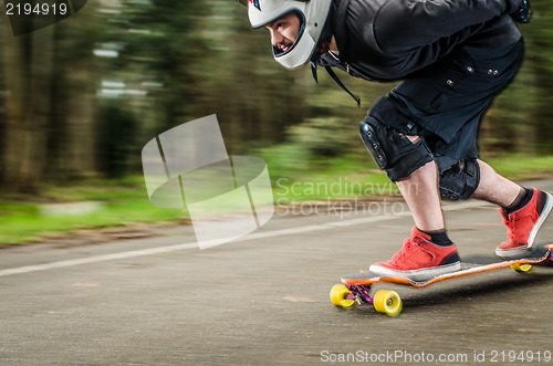 Image of Downhill skateboarder in action