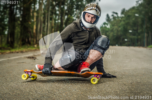 Image of Downhill skateboarder in action