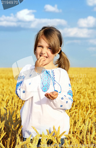 Image of small rural girl on wheat field