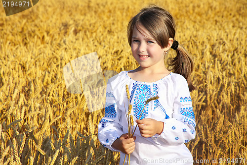 Image of small rural girl on wheat field