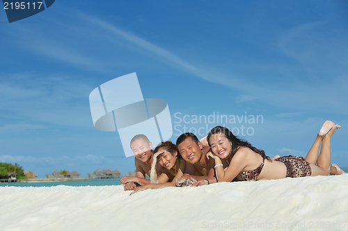 Image of group of happy young people have fun on bach