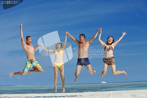 Image of group of happy young people have fun on bach