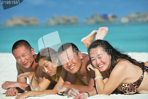 Image of group of happy young people have fun on bach