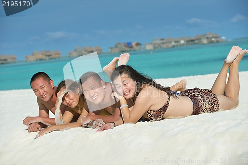 Image of group of happy young people have fun on bach