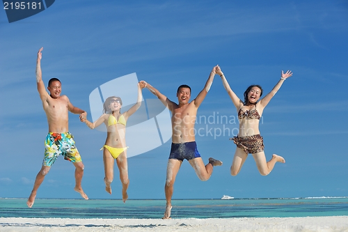 Image of group of happy young people have fun on bach