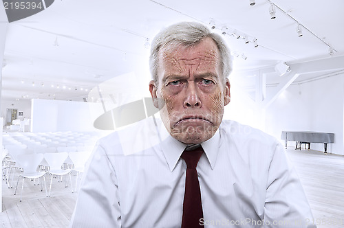 Image of Upset Caucasian businessman with huge frown