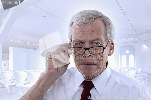 Image of Senior man peering at the camera