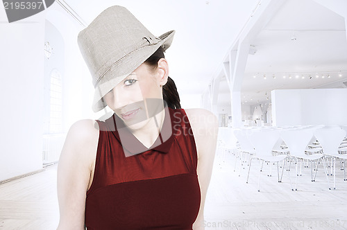 Image of Beautiful trendy woman with hat