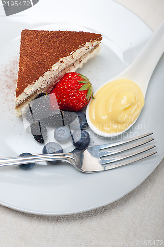 Image of tiramisu dessert with berries and cream