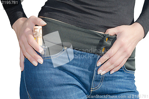 Image of Woman with roll of 50 euro in side pocket isolated