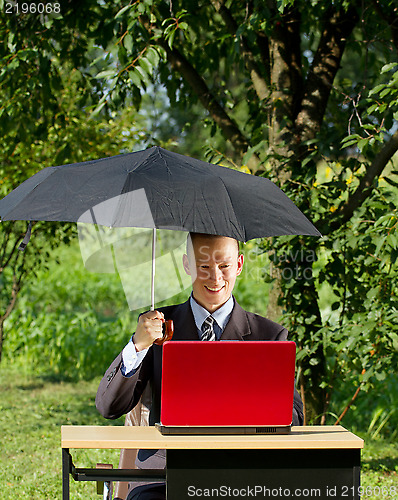 Image of Businessman Working Outdoors