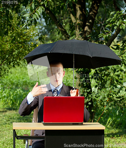 Image of Businessman Working Outdoors