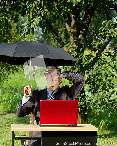 Image of Businessman Working Outdoors